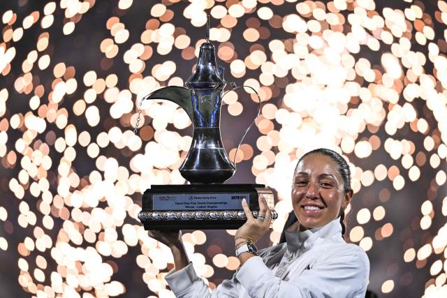 TOPSHOT - US' Jessica Pegula celebrates with the trophy after winning her women’s singles final match against Ukraine's Elina Svitolina at the Dubai Duty Free Tennis tournament in Dubai on February 21, 2026. (Photo by Ryan Lim / AFP)