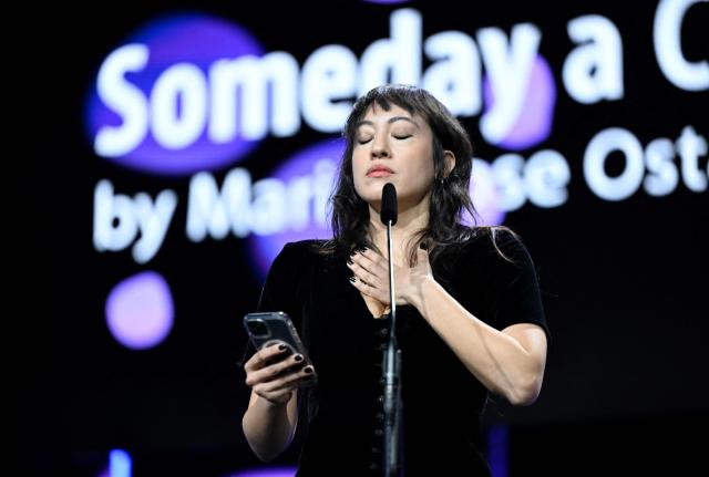 Lebanese scriptwriter and director Marie-Rose Osta accepts her Golden Bear for Best Short Film ("Yawman ma walad (Someday a Child)" during the Award Ceremony of the 76th Berlinale, Europe's first major film festival of the year, in Berlin on February 21, 2026. The 76th Berlin Film Festival draws to a close after 10 days, with 22 films in competition. (Photo by RALF HIRSCHBERGER / AFP)