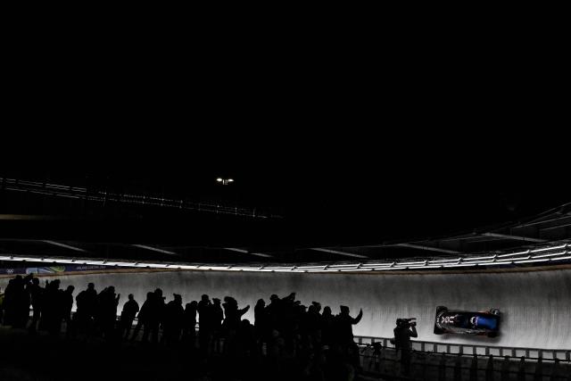 USA's Elana Meyers Taylorand USA's Jadin O'Brien compete in  the bobsleigh women's 2-woman heat 3 at Cortina Sliding Centre during the Milano Cortina 2026 Winter Olympic Games in Cortina d'Ampezzo on February 21, 2026. (Photo by Tiziana FABI / AFP)