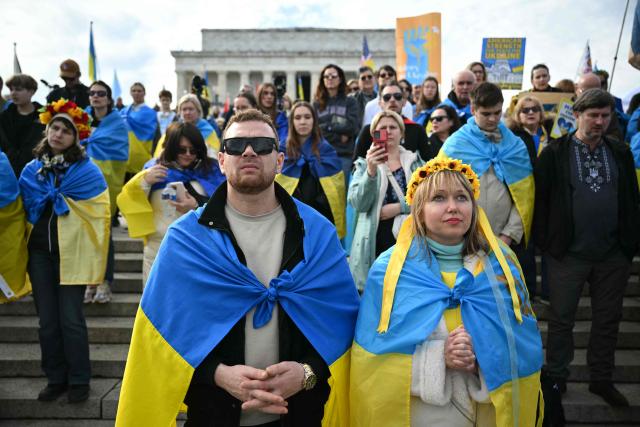 Activists take part in a rally to mark the fourth anniversary of Russia’s war on Ukraine, at the Lincoln Memorial in Washington, DC on February 21, 2026. (Photo by Mandel NGAN / AFP)