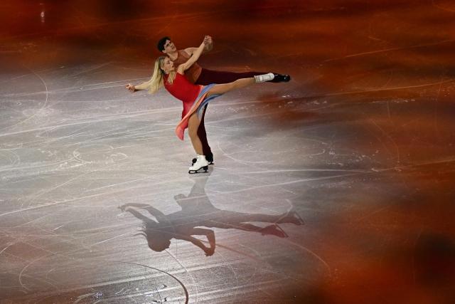 Canada's Piper Gilles and Canada's Paul Poirier perform at the figure skating exhibition gala during the Milano Cortina 2026 Winter Olympic Games at Milano Ice Skating Arena in Milan on February 21, 2026. (Photo by Gabriel BOUYS / AFP)