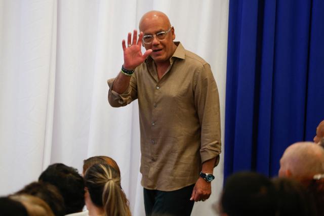 The President of the National Assembly Jorge Rodriguez waves upon arrival for a press conference in Caracas on February 21, 2026. More than 1,500 political prisoners in Venezuela have applied for amnesty under a new law, the head of the country's legislature said on February 21, two days after the measure -- enacted under pressure from Washington -- came into effect. (Photo by Pedro MATTEY / AFP)
