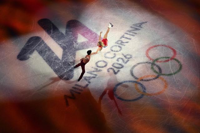Canada's Piper Gilles and Paul Poirier perform at the figure skating exhibition gala during the Milano Cortina 2026 Winter Olympic Games at Milano Ice Skating Arena in Milan on February 21, 2026. (Photo by Antonin THUILLIER / AFP)