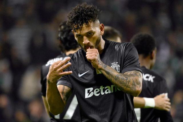 TOPSHOT - Sporting Lisbon's Colombian forward #97 Luis Suarez celebrates scoring his team's third goal during the Portuguese League football match between Moreirense FC and Sporting CP at Comendador Joaquim de Almeida Freitas stadium in Moreira de Conegos on February 21, 2026. (Photo by Miguel RIOPA / AFP)