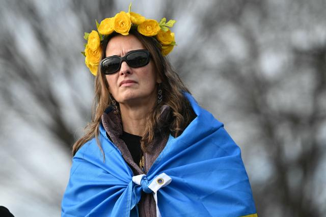 An activists takes part in a rally to mark the fourth anniversary of Russia’s war on Ukraine, at the Lincoln Memorial in Washington, DC on February 21, 2026. (Photo by Mandel NGAN / AFP)