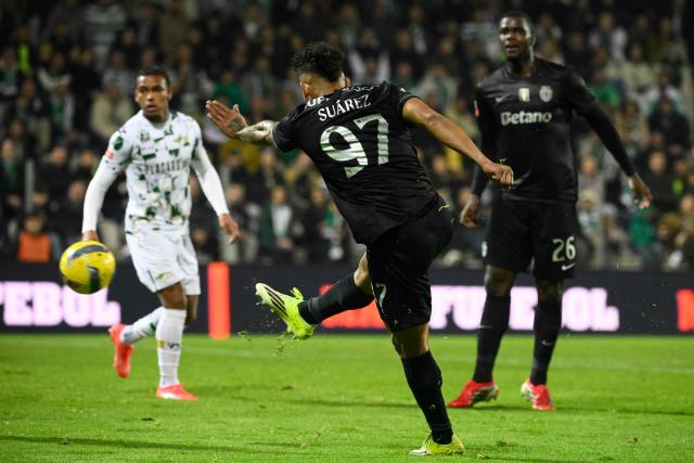 Sporting Lisbon's Colombian forward #97 Luis Suarez scores his team's third goal during the Portuguese League football match between Moreirense FC and Sporting CP at Comendador Joaquim de Almeida Freitas stadium in Moreira de Conegos on February 21, 2026. (Photo by Miguel RIOPA / AFP)