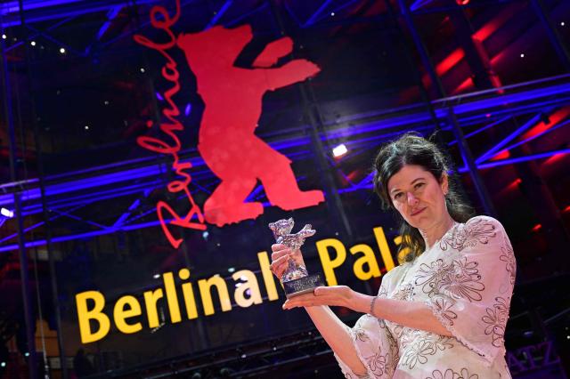 US director Anna Fitch poses after winning the Silver Bear for Oustanding Artistic Contribution for the movie "Yo" (Love is a Rebellious Bird) at the 76th Berlinale, Europe's first major film festival of the year, in Berlin on February 21, 2026. The 76th Berlin Film Festival draws to a close after 10 days, with 22 films in competition. (Photo by John MACDOUGALL / AFP)