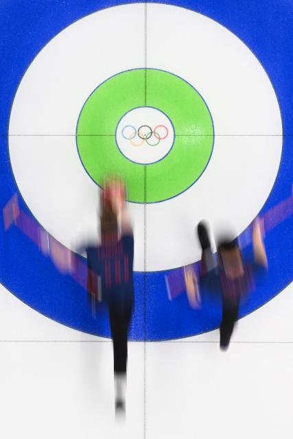 Team GB curls during the curling men's gold medal game between Great Britain and Canada during the Milano Cortina 2026 Winter Olympic Games at the Cortina Curling Olympic Stadium in Cortina d’Ampezzo on February 21, 2026. (Photo by Franзois-Xavier MARIT / AFP)