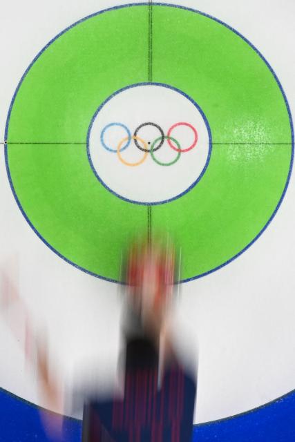 Team GB curls during the curling men's gold medal game between Great Britain and Canada during the Milano Cortina 2026 Winter Olympic Games at the Cortina Curling Olympic Stadium in Cortina d’Ampezzo on February 21, 2026. (Photo by Franзois-Xavier MARIT / AFP)