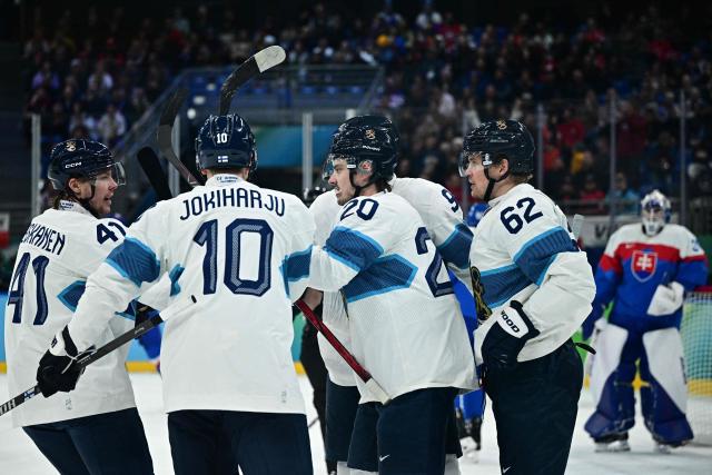 Finland's #41 Miro Heiskanen, Finland's #10 Henri Jokiharju, Finland's #20 Sebastian Aho and Finland's #62 Artturi Lehkonen react during the men's bronze medal ice hockey match between Slovakia and Finland at the Milano Santagiulia Ice Hockey Arena during the Milano Cortina 2026 Winter Olympic Games in Milan, on February 21, 2026. (Photo by JULIEN DE ROSA / AFP)