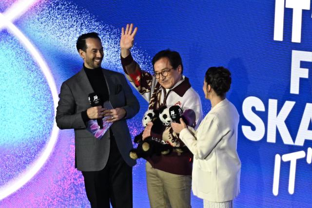 Hong Kong actor Jackie Chan (C) waves during an inverview at the figure skating exhibition gala during the Milano Cortina 2026 Winter Olympic Games at Milano Ice Skating Arena in Milan on February 21, 2026. (Photo by Gabriel BOUYS / AFP)