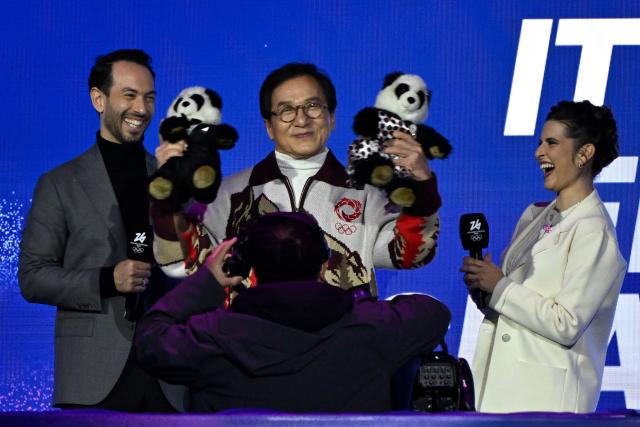 Actor Jackie Chan (C) gestures while attending the figure skating exhibition gala during the Milano Cortina 2026 Winter Olympic Games at Milano Ice Skating Arena in Milan on February 21, 2026. (Photo by WANG Zhao / AFP)