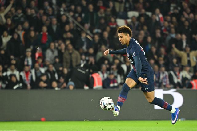 Paris Saint-Germain's French midfielder #14 Desire Doue shoots to score his team's first goal during the French L1 football match between Paris Saint-Germain (PSG) and FC Metz at the Parc des Princes stadium in Paris on February 21, 2026. (Photo by Bertrand GUAY / AFP)