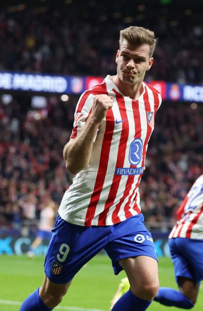 Atletico Madrid's Norwegian forward #09 Alexander Sorloth celebrates an equalizing goal during the Spanish league football match between Club Atletico de Madrid and RCD Espanyol at Metropolitano Stadium in Madrid on February 21, 2026. (Photo by Pierre-Philippe MARCOU / AFP)