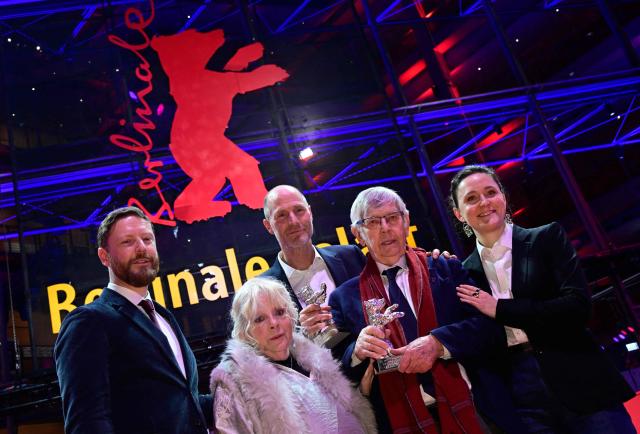 British actor Tom Courtenay (2nd R) and British actress Anna Calder-Marshall (2nd L) with the Silver Bear for Best Supporting Performance for the film "Queen at Sea" as well as US director Lance Hammer (3rd R) and Northern Irish film producer Tristan Goligher (L) with the Silver Bear Jury Prize for the movie "Queen at Sea" pose after the award ceremony at the 76th Berlinale, Europe's first major film festival of the year, in Berlin on February 21, 2026. The 76th Berlin Film Festival draws to a close after 10 days, with 22 films in competition. (Photo by John MACDOUGALL / AFP)