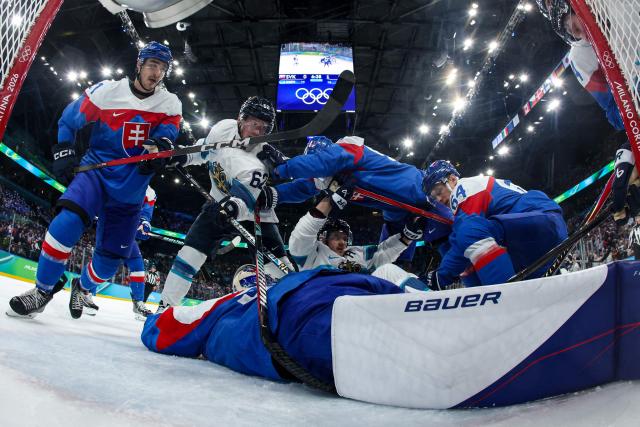 Slovakia's #31 Samuel Hlavaj makes a save during the men's bronze medal ice hockey match between Slovakia and Finland at the Milano Santagiulia Ice Hockey Arena during the Milano Cortina 2026 Winter Olympic Games in Milan, on February 21, 2026. (Photo by POOL / AFP)