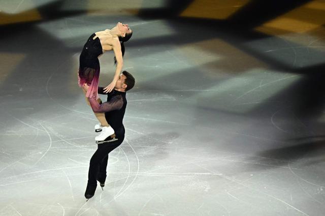 Italy's Charlene Guignard and Italy's Marco Fabbri perform at the figure skating exhibition gala during the Milano Cortina 2026 Winter Olympic Games at Milano Ice Skating Arena in Milan on February 21, 2026. (Photo by Gabriel BOUYS / AFP)