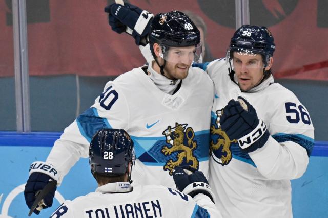 Finland's #40 Joel Armia and Finland's #56 Erik Haula celebrate after their team's second  goal during the men's bronze medal ice hockey match between Slovakia and Finland at the Milano Santagiulia Ice Hockey Arena during the Milano Cortina 2026 Winter Olympic Games in Milan, on February 21, 2026. (Photo by Alexander NEMENOV / AFP)