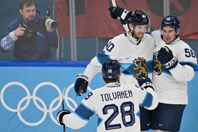 Finland's #40 Joel Armia, Finland's #56 Erik Haula and Finland's #28 Eeli Tolvanen celebrate after their team's second goal during the men's bronze medal ice hockey match between Slovakia and Finland at the Milano Santagiulia Ice Hockey Arena during the Milano Cortina 2026 Winter Olympic Games in Milan, on February 21, 2026. (Photo by Alexander NEMENOV / AFP)