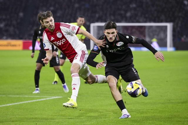 Ajax's Dutch midfielder #06 Youri Regeer (L) fights for the ball with Nijmegen's Turkish defender Ahmetcan Kaplan with kaplduring the Dutch Eredivisie football match between Ajax Amsterdam and NEC Nijmegen at the Johan Cruijff ArenA in Amsterdam on February 21, 2026. (Photo by Olaf Kraak / ANP / AFP) / Netherlands OUT