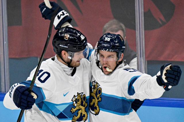Finland's #40 Joel Armia and Finland's #56 Erik Haula celebrate after their team's second  goal during the men's bronze medal ice hockey match between Slovakia and Finland at the Milano Santagiulia Ice Hockey Arena during the Milano Cortina 2026 Winter Olympic Games in Milan, on February 21, 2026. (Photo by Alexander NEMENOV / AFP)