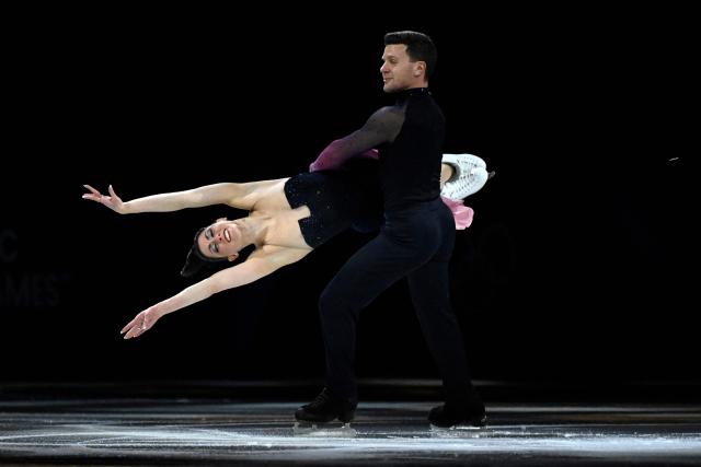 Italy's Marco Fabbri and Charlene Guignard perform at the figure skating exhibition gala during the Milano Cortina 2026 Winter Olympic Games at Milano Ice Skating Arena in Milan on February 21, 2026. (Photo by WANG Zhao / AFP)
