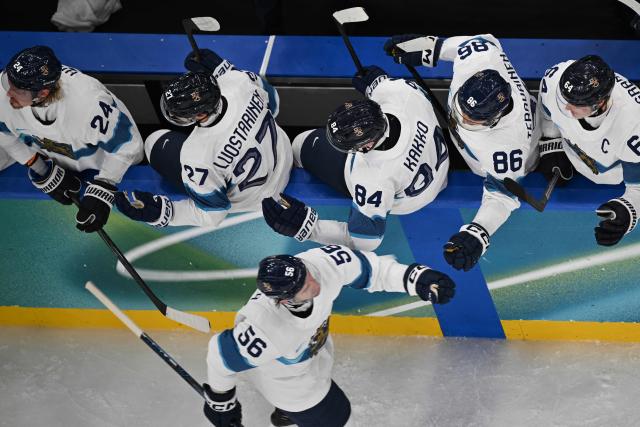 Finland's #56 Erik Haula celebrates with teammates after scoring his team's second goal during the men's bronze medal ice hockey match between Slovakia and Finland at the Milano Santagiulia Ice Hockey Arena during the Milano Cortina 2026 Winter Olympic Games in Milan, on February 21, 2026. (Photo by Alexander NEMENOV / AFP)