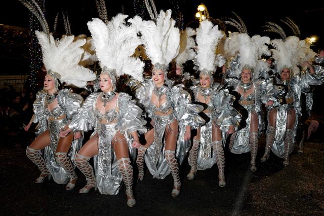 Artists perform during the 141th edition of the Nice Carnival in the French Riviera City of Nice on February 21, 2026. The edition 2026 of the Nice Carnival, whose theme is "Long live the Queen", takes place until March 1, 2026. (Photo by Valery HACHE / AFP)