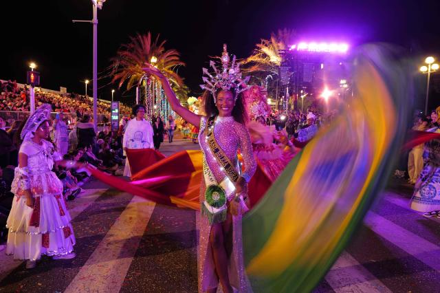 Artists perform during the 141th edition of the Nice Carnival in the French Riviera City of Nice on February 21, 2026. The edition 2026 of the Nice Carnival, whose theme is "Long live the Queen", takes place until March 1, 2026. (Photo by Valery HACHE / AFP)