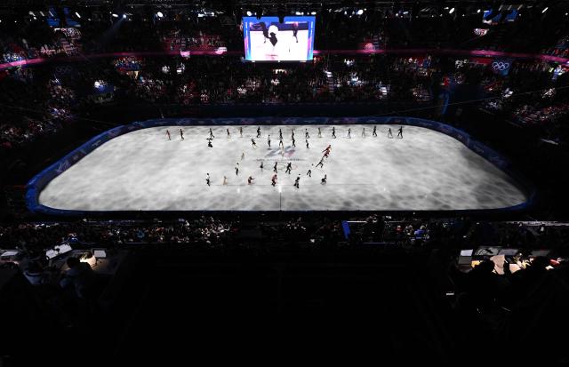 Skaters perform at the finale of the figure skating exhibition gala during the Milano Cortina 2026 Winter Olympic Games at Milano Ice Skating Arena in Milan on February 21, 2026. (Photo by Antonin THUILLIER / AFP)