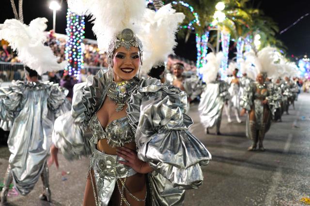 An artist parades during the 141th edition of the Nice Carnival in the French Riviera City of Nice on February 21, 2026. The edition 2026 of the Nice Carnival, whose theme is "Long live the Queen", takes place until March 1, 2026. (Photo by Valery HACHE / AFP)