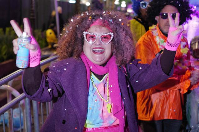 A participant parades during the 141th edition of the Nice Carnival in the French Riviera City of Nice on February 21, 2026. The edition 2026 of the Nice Carnival, whose theme is "Long live the Queen", takes place until March 1, 2026. (Photo by Valery HACHE / AFP)