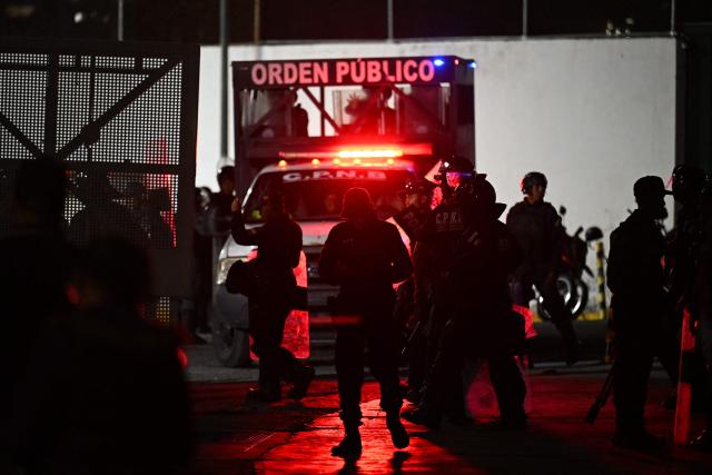 Members of the Venezuelan National Police stand guard outside of the Bolivarian National Police (PNB) Zone 7 prison in Caracas on February 21, 2026. More than 1,500 political prisoners in Venezuela have applied for amnesty under a new law, the head of the country's legislature said on February 21, two days after the measure -- enacted under pressure from Washington -- came into effect. (Photo by Juan BARRETO / AFP)