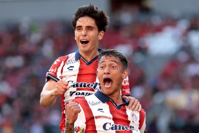 San Luis' defender #31 Eduardo Aguila (R) celebrates scoring his team's second goal during the Liga MX Clausura football match between Atlas and San Luis at the Jalisco Stadium in Guadalajara, state of Jalisco, Mexico, on February 21, 2026. (Photo by Ulises Ruiz / AFP)