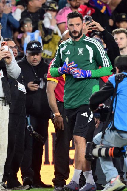 LAFC' French goalkeeper #01 Hugo Lloris takes the field before the start of the Major League Soccer opening match between Los Angeles Football Club and Inter Miami CF at the LA Memorial Coliseum in Los Angeles, on February 21, 2026. (Photo by Frederic J. Brown / AFP)