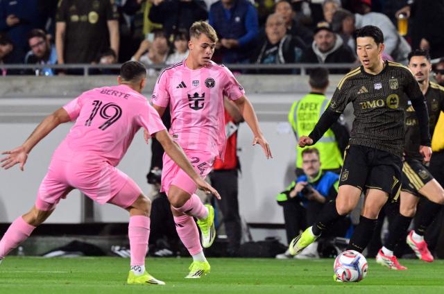 LAFC's South Korean forward #07 Son Heung-min (R) drives the ball against Inter Miami's Mexican midfielder #19 German Berterame and Argentine midfielder #24 Mateo Silvetti during the Major League Soccer opening match between Los Angeles Football Club and Inter Miami CF at the LA Memorial Coliseum in Los Angeles, on February 21, 2026. (Photo by Frederic J. Brown / AFP)