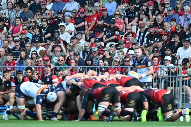 Spectators watch round two of the Super Rugby Pacific match between the Crusaders and Brumbies at Apollo Projects Stadium in Christchurch on February 22, 2026. (Photo by Sanka VIDANAGAMA / AFP)