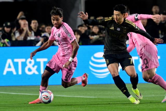 Inter Miami's Venezuelan midfielder #08 Telasco Segovia (L) controls the ball against LAFC's South Korean forward #07 Son Heung-min during the Major League Soccer opening match between Los Angeles Football Club and Inter Miami CF at the LA Memorial Coliseum in Los Angeles, on February 21, 2026. (Photo by Frederic J. Brown / AFP)