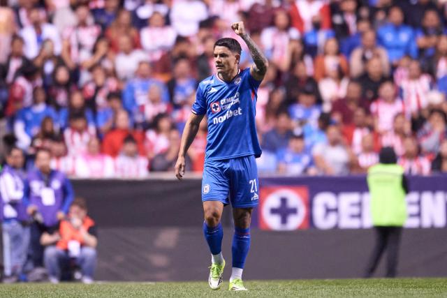 Cruz Azul's Uruguayan forward #21 Gabriel Fernandez celebrates scoring his team's first goal during the Liga MX Clausura football match between Cruz Azul and Guadalajara at the Cuauhtemoc Stadium in Puebla, Mexico on February 21, 2026. (Photo by Jacobo PEREZ / AFP)