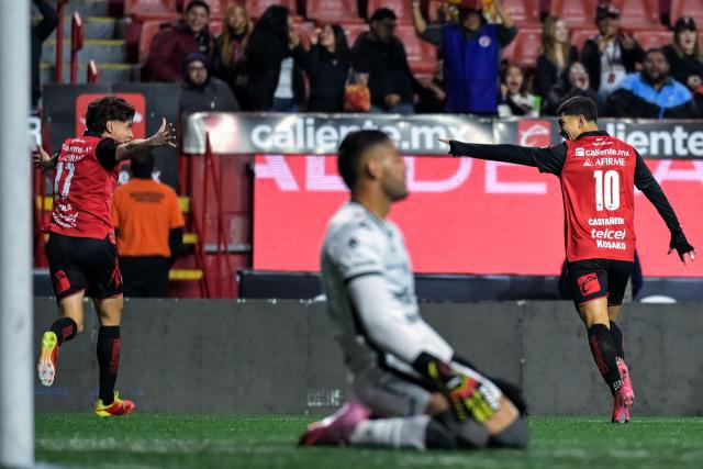 Tijuana's midfielder #10 Kevin Castaneda (R) celebrates scoring his team's first goal during the Liga MX Clausura football match between Tijuana and Mazatlan at the Caliente Stadium in Tijuana, Mexico on February 21, 2026. (Photo by Guillermo Arias / AFP)