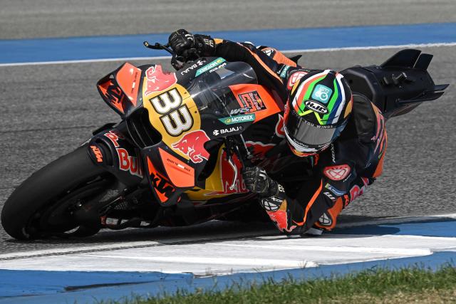 Red Bull KTM Factory Racing's South African rider Brad Binder rides on the track during the second day of the 2026 MotoGP pre-season test at the Buriram International Circuit in Buriram on February 22, 2026. (Photo by Lillian SUWANRUMPHA / AFP)