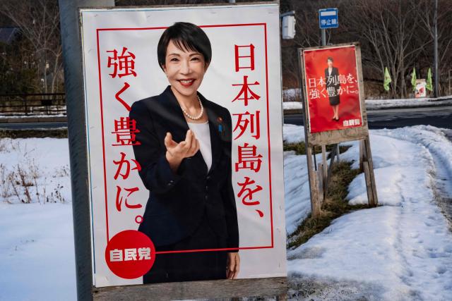 Liberal Democratic Party (LDP) poster boards featuring Japan's Prime Minister Sanae Takaichi stand in the snow in Date, Hokkaido prefecture in northern Japan on February 22, 2026. (Photo by Yuichi YAMAZAKI / AFP)