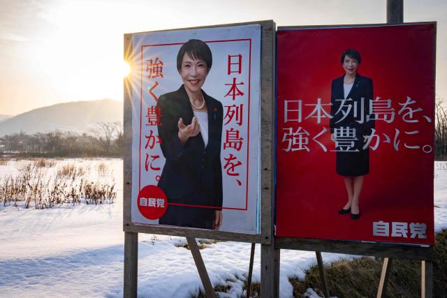 Liberal Democratic Party (LDP) poster boards featuring Japan's Prime Minister Sanae Takaichi stand in the snow in Date, Hokkaido prefecture in northern Japan on February 22, 2026. (Photo by Yuichi YAMAZAKI / AFP)