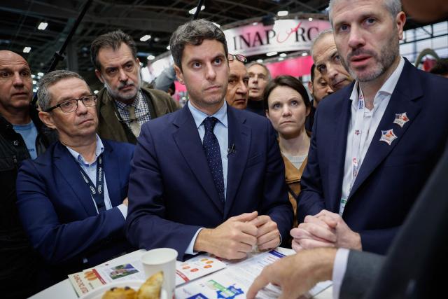 President of Ensemble Pour la Republique parliamentary group Gabriel Attal (C) listens to explanations as he visits the International Agricultural Show (Salon de l'Agriculture) at Paris Expo Porte de Versailles in Paris on February 22, 2026. (Photo by Charlotte SIEMON / AFP)