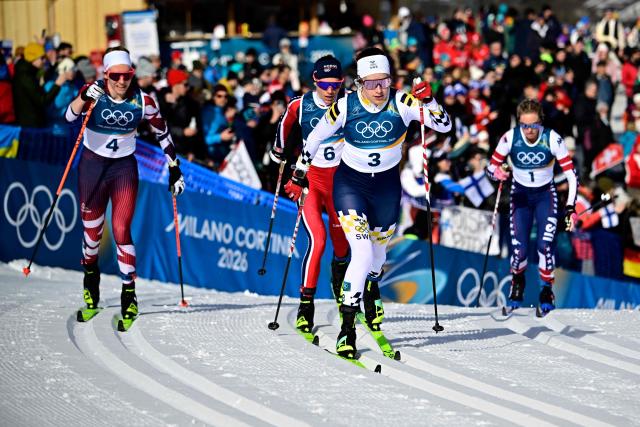 Austria's Teresa Stadlober (L), Norway's Heidi Weng, Sweden's Ebba Andersson and USA's Jessie Diggins compete during the women's cross country 50km mass start final event of the Milano Cortina 2026 Winter Olympic Games at Tesero Cross-Country Skiing Stadium in Lago di Tesero (Val di Fiemme), on February 22, 2026. (Photo by Tobias SCHWARZ / AFP)