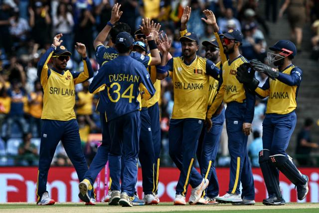Sri Lanka players celebrate after the dismissal of England's Jacob Bethell during the 2026 ICC Men's T20 Cricket World Cup Super Eights match between Sri Lanka and England at Pallekele International Cricket Stadium in Kandy on February 22, 2026. (Photo by Ishara S. KODIKARA / AFP)