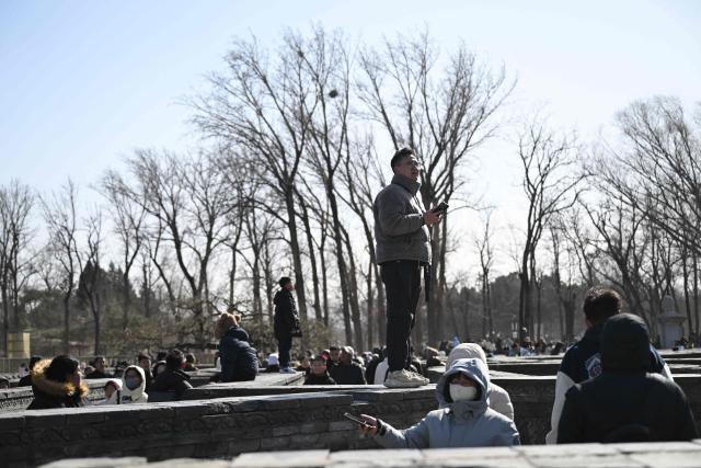 People visit the labyrinth of the ruins of the Old Summer Palace at Yuanmingyuan Park on the sixth day of the Lunar New Year of the Horse in Beijing on February 22, 2026. (Photo by Pedro PARDO / AFP)