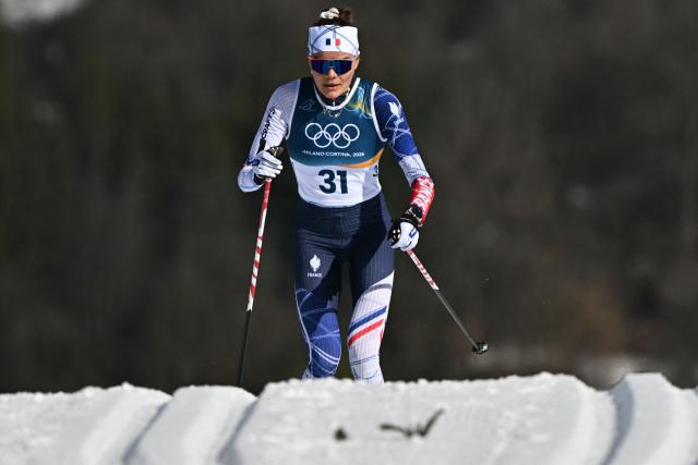 France's Cloe Pagnier competes during the women's cross country 50km mass start final event of the Milano Cortina 2026 Winter Olympic Games at Tesero Cross-Country Skiing Stadium in Lago di Tesero (Val di Fiemme), on February 22, 2026. (Photo by Javier SORIANO / AFP)