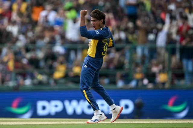 Sri Lanka's Dunith Wellalage celebrates after taking the wicket of England's captain Harry Brook during the 2026 ICC Men's T20 Cricket World Cup Super Eights match between Sri Lanka and England at Pallekele International Cricket Stadium in Kandy on February 22, 2026. (Photo by Dibyangshu SARKAR / AFP)