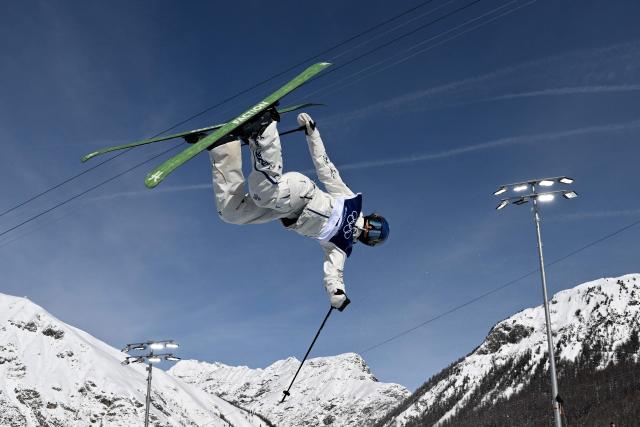 China's Gu Ailing Eileen competes in the freestyle skiing women's freeski halfpipe final run 3 during the Milano Cortina 2026 Winter Olympic Games at Livigno Snow Park, in Livigno (Valtellina), on February 22, 2026. (Photo by Jeff PACHOUD / AFP)